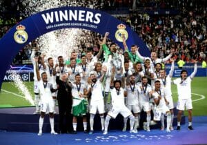 Real Madrid players celebrate lifting the trophy after winning the UEFA