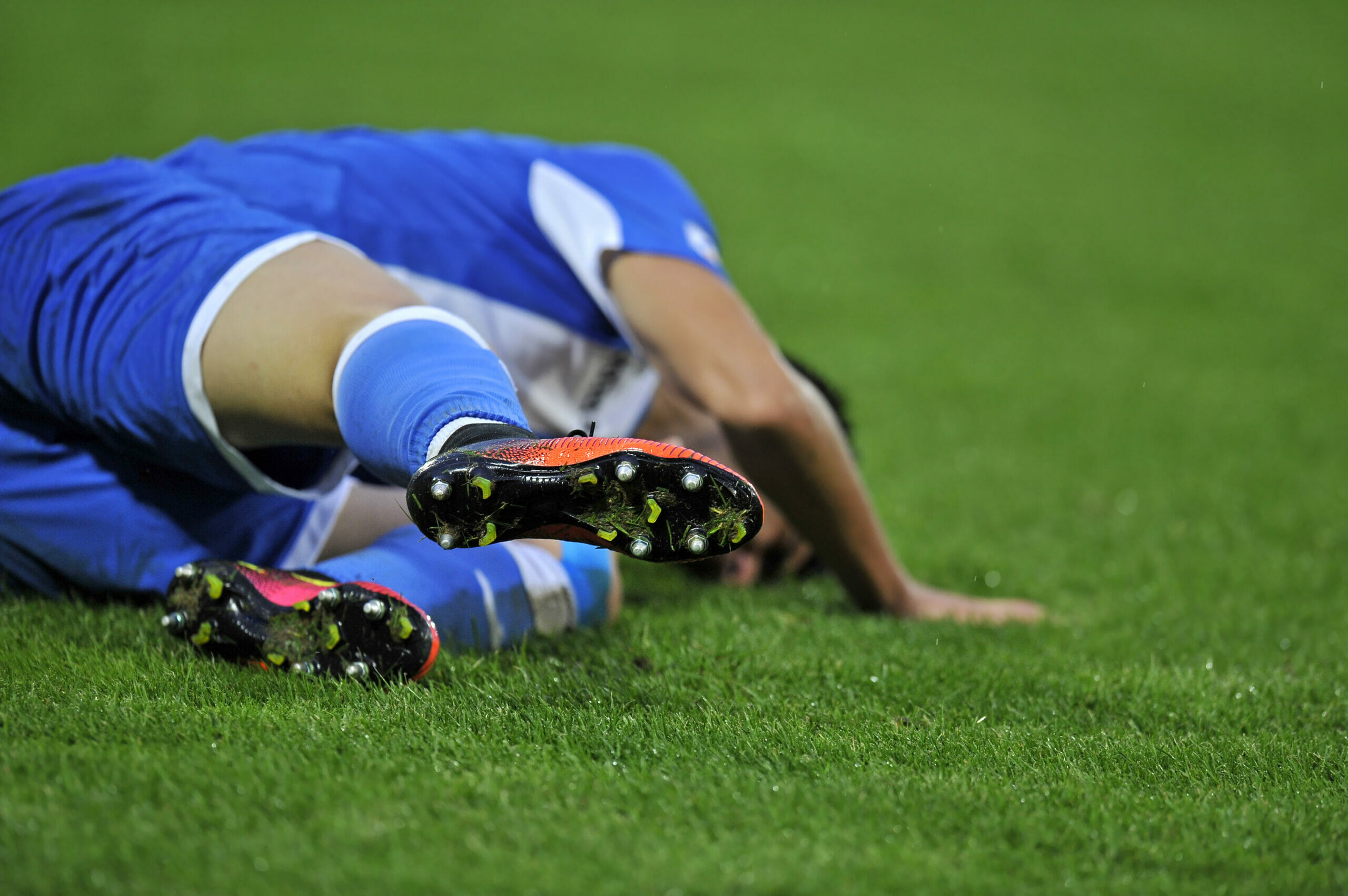 Injured football player on field