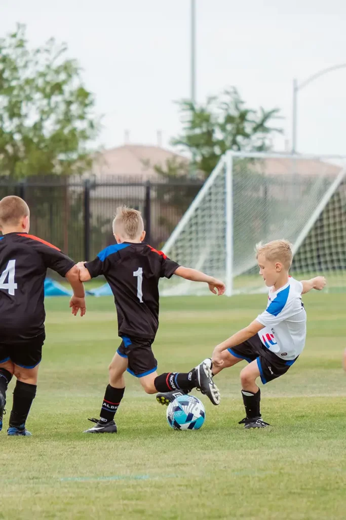 children playing football
